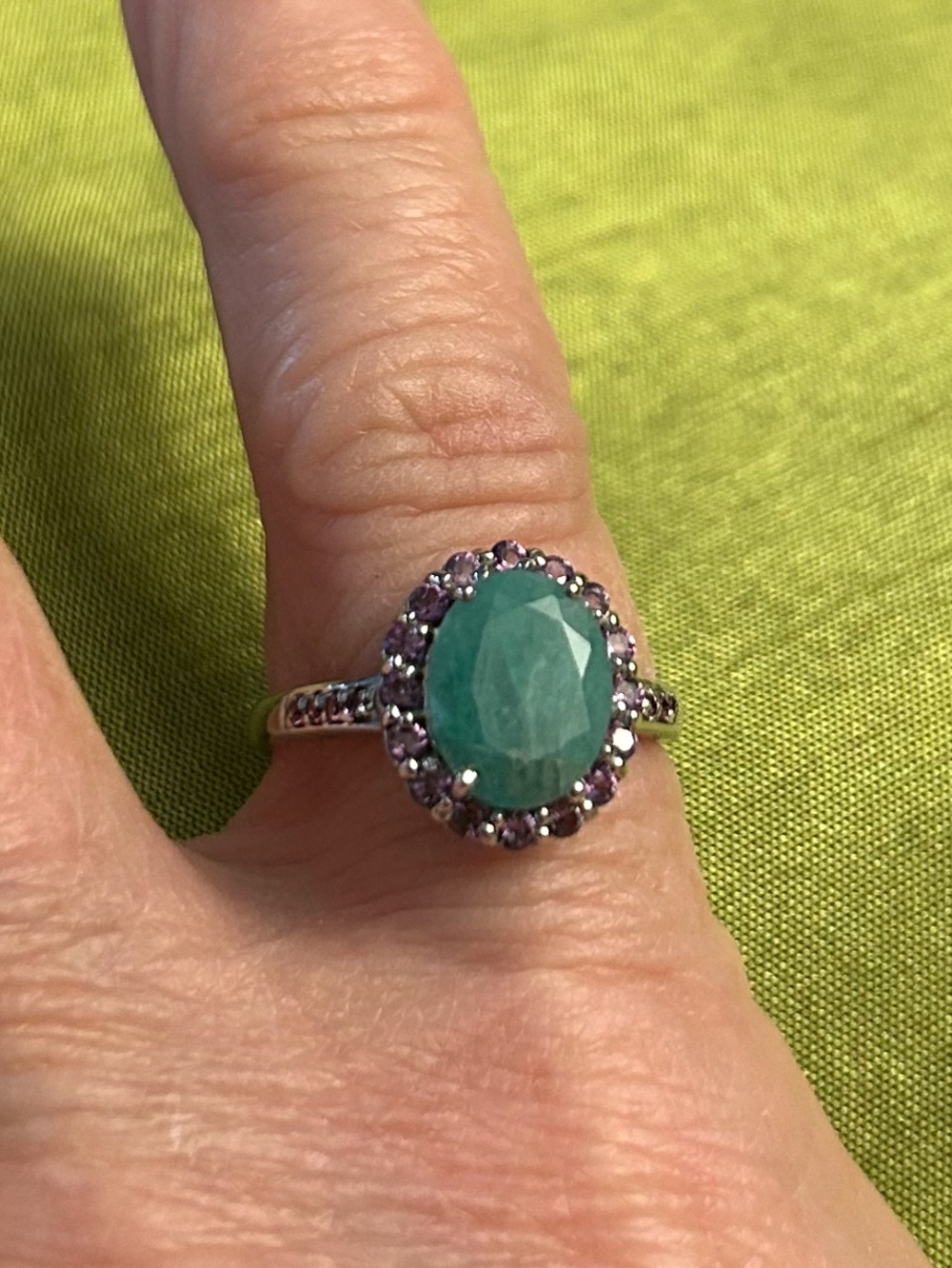 Genuine 8 mm by 10mm Emerald- Halo Ring with Genuine Amethysts
See Video - Picture 9 of 9